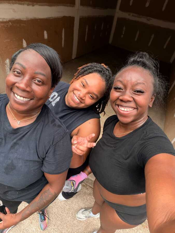 The women behind Bin Gone Trash smiling together