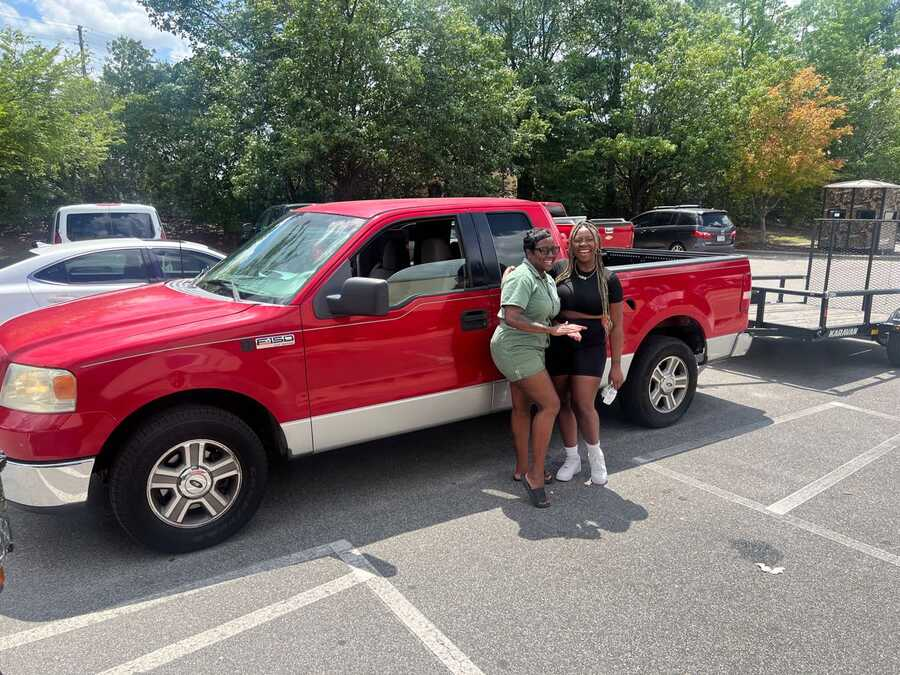 Bin Gone Trash team with their pickup truck and hauling trailer